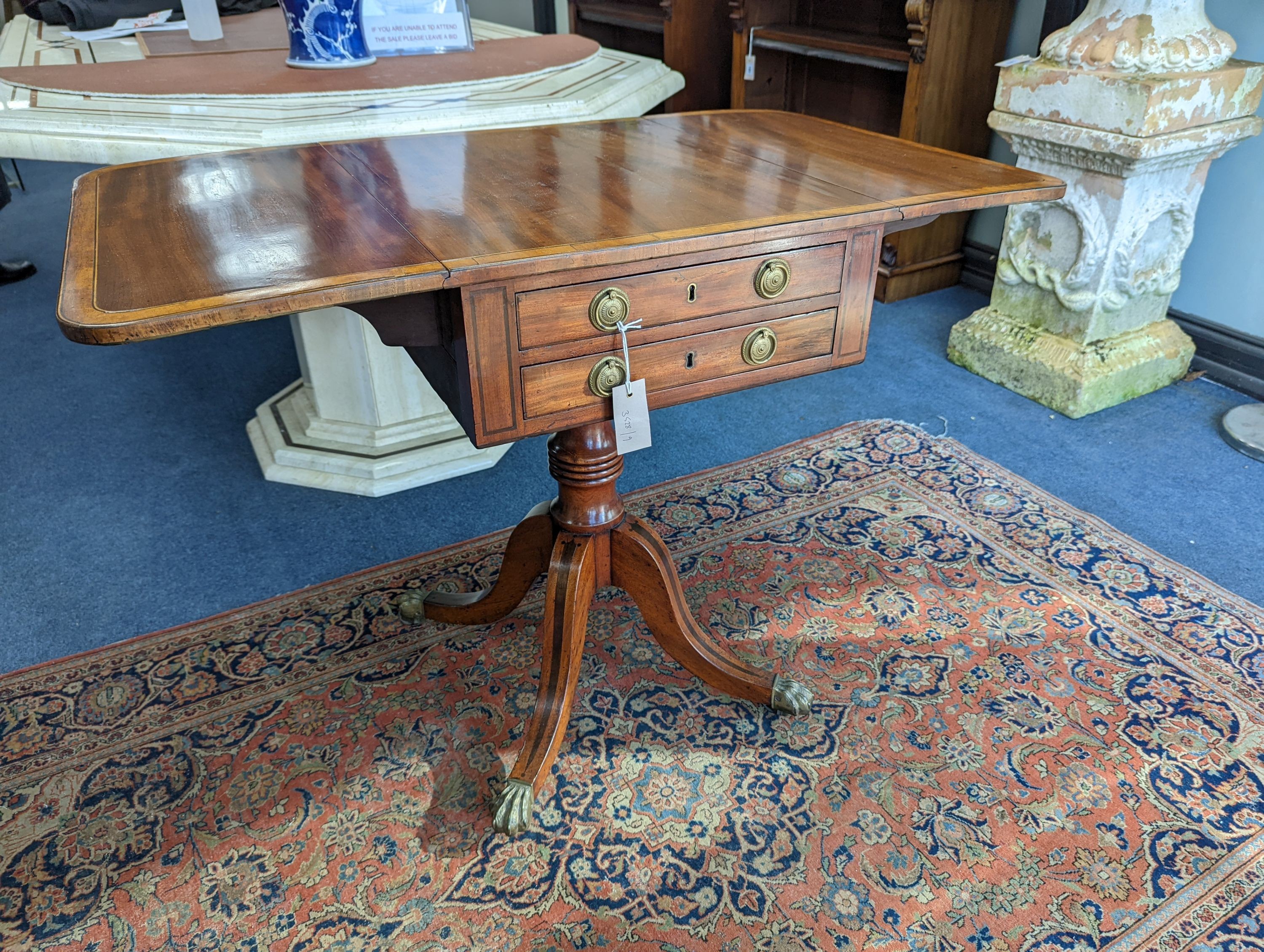 A Regency satinwood banded mahogany drop flap centre table, width 98cm extended, depth 56cm, height 73cm